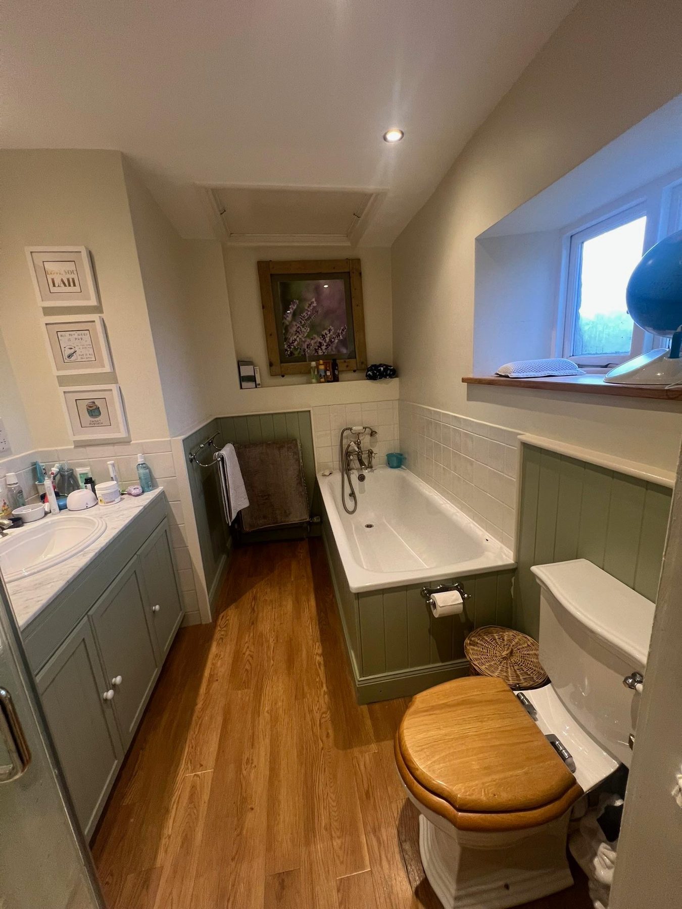 Family bathroom with vanity and bath