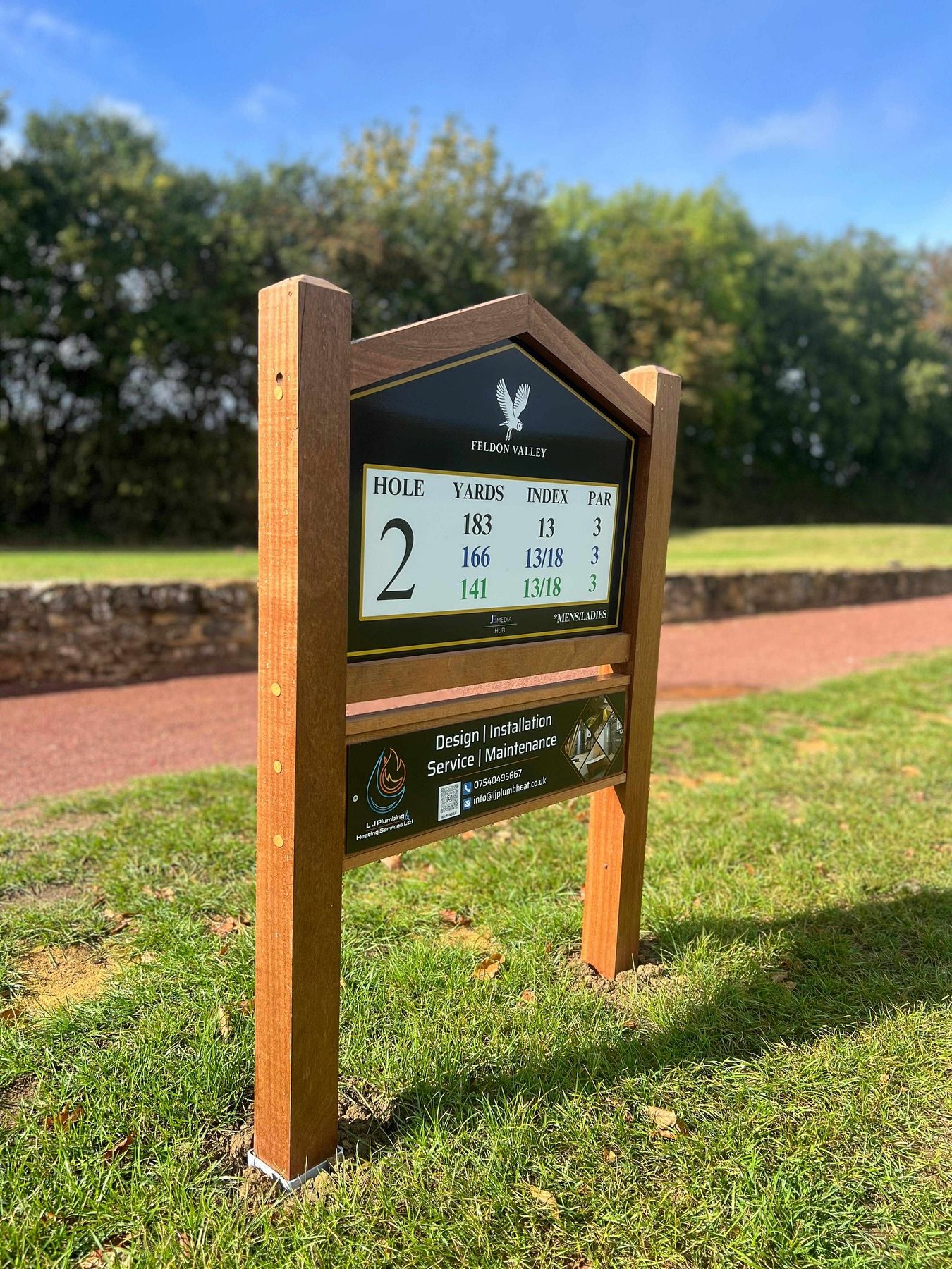 Hole 2 tee sign at Feldon Valley, sponsored by L J Plumbing and Heating Services