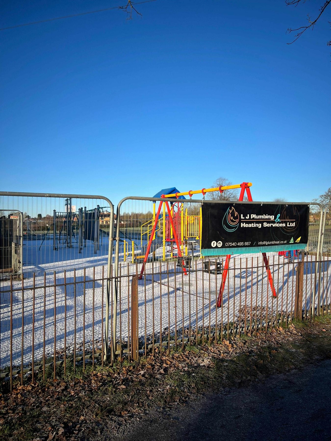 Company banner on the closed playground at Bodicote Village Hall
