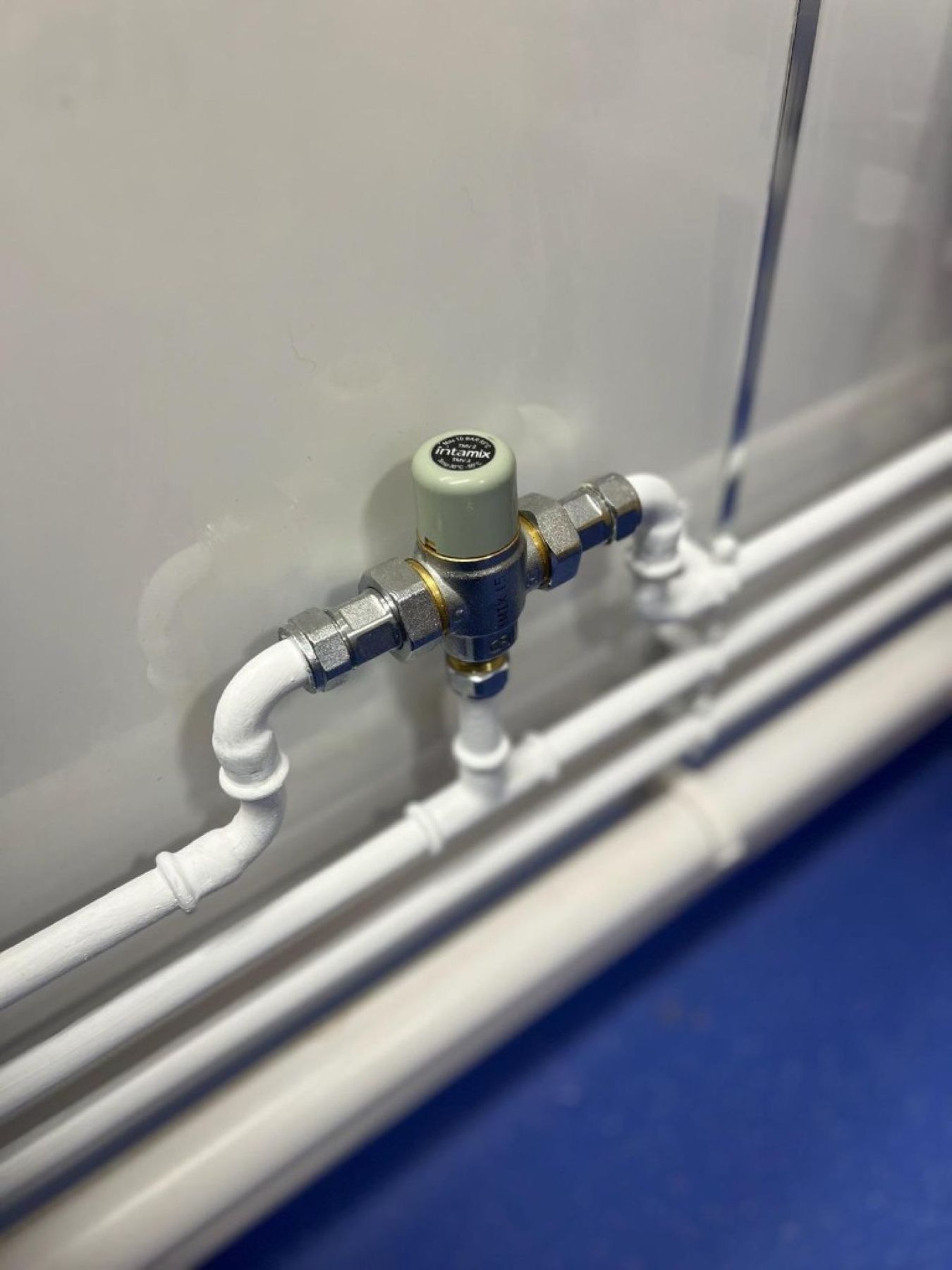 Intamix thermostatic blending valve on the hot water supply