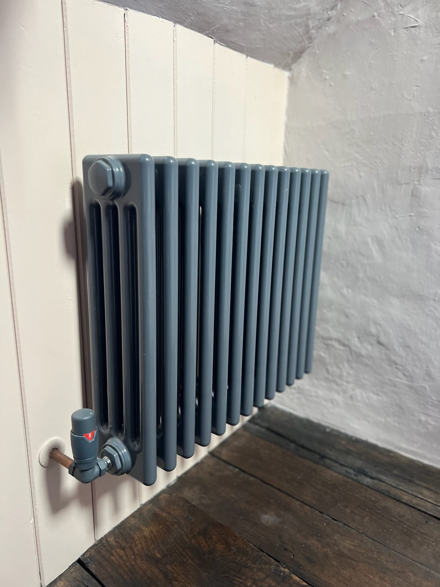 Column radiator against period joinery