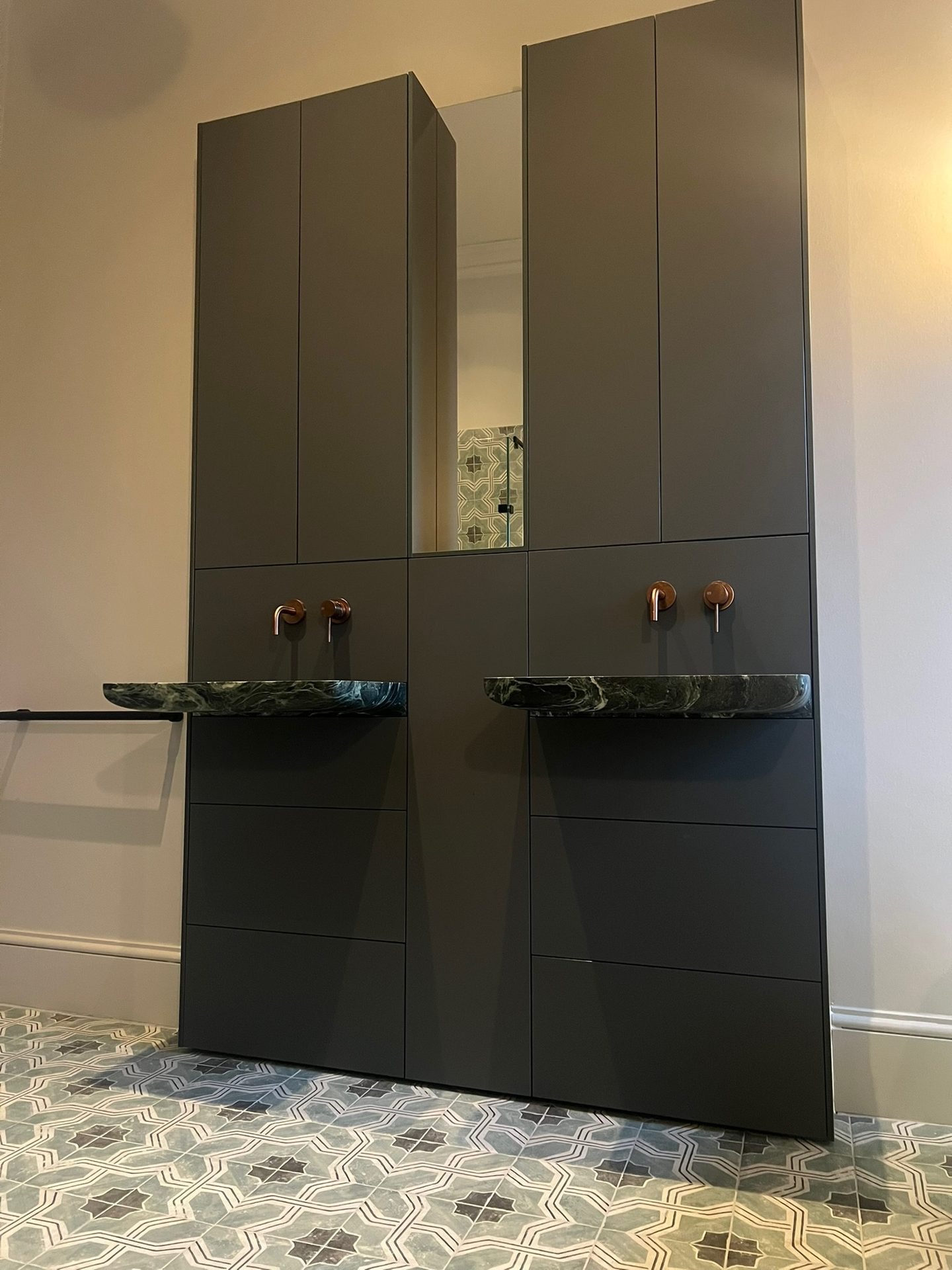 Stone-effect basins and copper taps