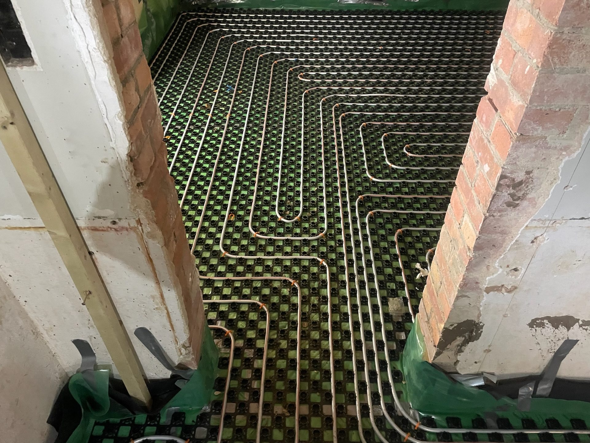 Underfloor heating set out before screed, during technical preparation