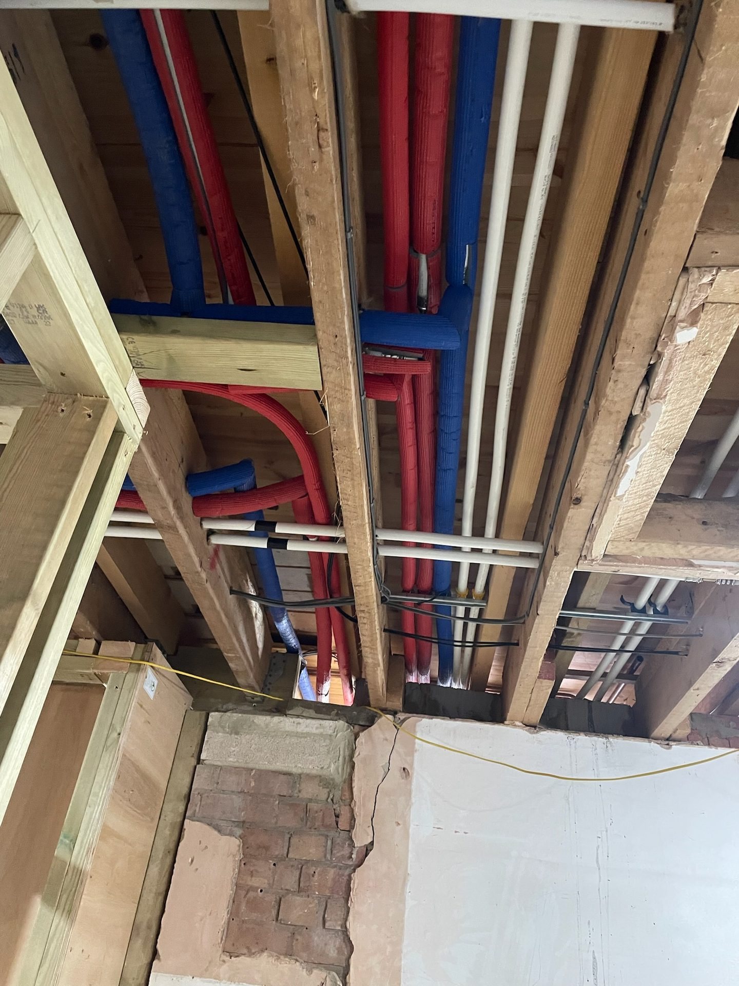 First-fix pipework prepared before finishes