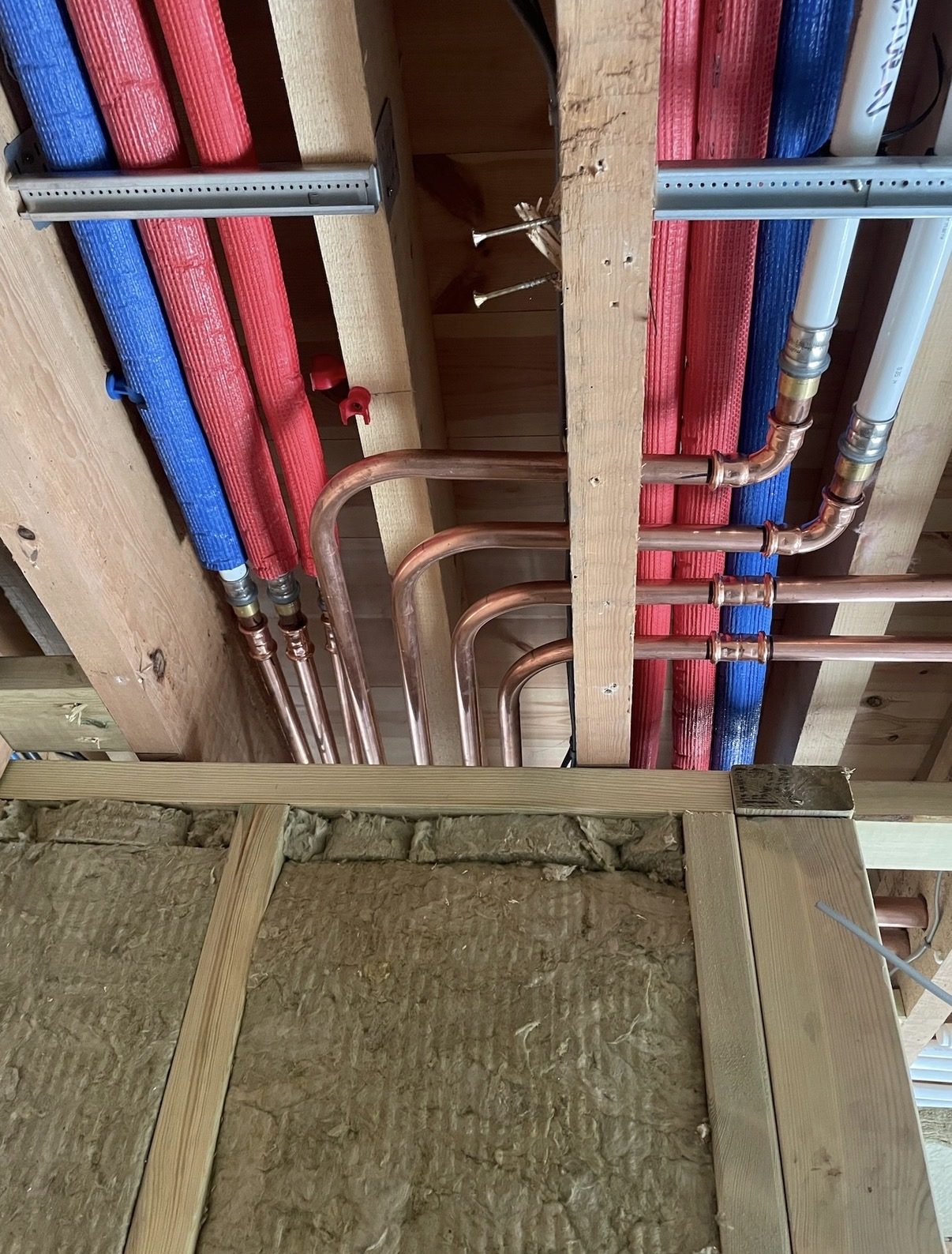 First-fix pipework through the structure